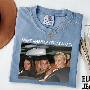a t - shirt with a picture of three women in a car