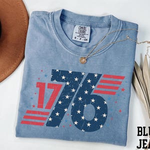 a blue shirt with the number seventy on it