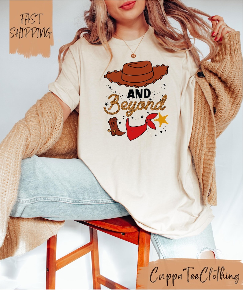 a woman sitting on a stool wearing a t - shirt