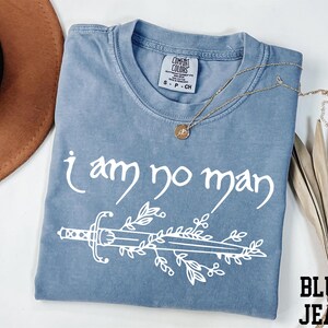 a t - shirt that says i am no man on it