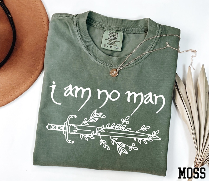 a t - shirt that says i am no man on it