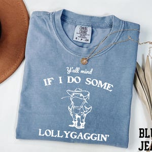 a blue t - shirt that says if i do some lollygagin '