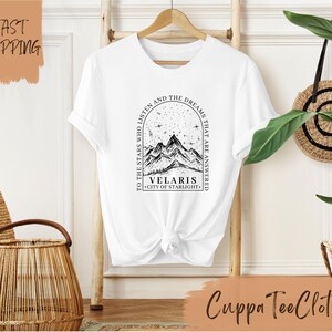 a t - shirt with a picture of a mountain on it