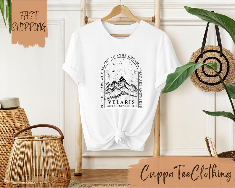 a t - shirt with a picture of a mountain on it