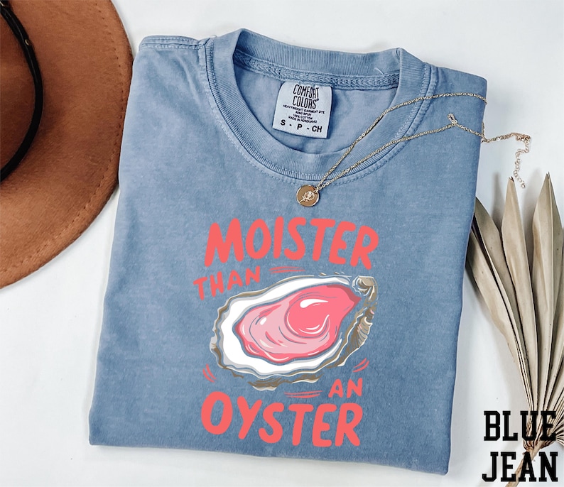 a t - shirt with a picture of an oyster on it