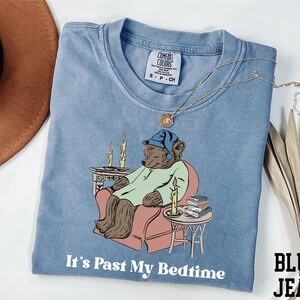 a t - shirt with a picture of a bear on it