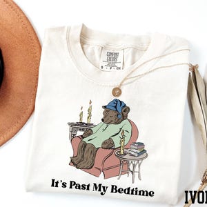 a t - shirt with a picture of a bear on it