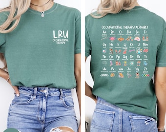 May include: Light green t-shirt with the text "LRU OCCUPATIONAL THERAPY" on the front. The back of the shirt displays an "OCCUPATIONAL THERAPY ALPHABET" with colourful illustrations. The model is wearing blue jeans.