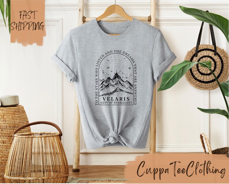 a t - shirt with a picture of a mountain on it