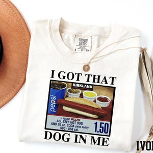 a t - shirt with a picture of a hot dog on it