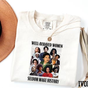 a white t-shirt with a collage of diverse women's faces and the text "WELL-BEHAVED WOMEN SEldom MAKE HISTORY" printed on it.