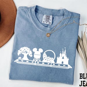 a blue tshirt with mickey mouse on it