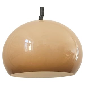 May include: A tan-colored, dome-shaped pendant light fixture. The light has a glossy finish and a white underside. A black, coiled cord extends from the top of the light. The light reflects the surrounding environment.