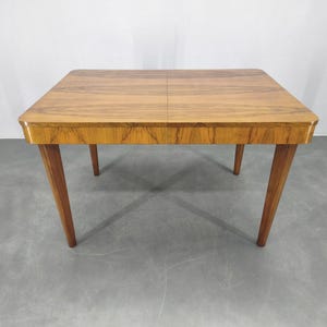 May include: A rustic wooden sign with the text "Welcome to our home" in white lettering. The sign features a distressed finish and a simple, inviting design, perfect for a front porch or entryway.