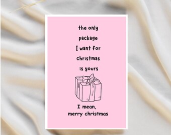 May include: A pink greeting card with the text "the only package I want for christmas is yours. I mean, merry christmas." A black and white line drawing of a gift box is in the center.