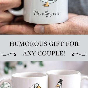 May include: White ceramic mugs featuring cartoon geese. One goose wears a veil and the text "Mrs. silly goose", the other wears a top hat and bow tie with the text "Mr. silly goose".