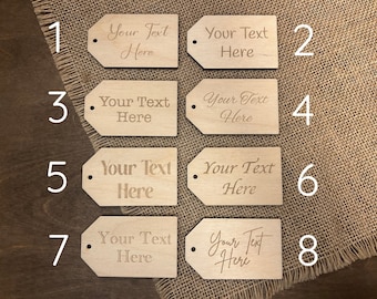 May include: Eight wooden gift tags with a hole at the top. Each tag has the text "Your Text Here" engraved on it. The tags are numbered 1 through 8.
