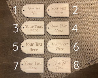 May include: Eight wooden tags with rounded edges and holes. Each tag has the text "Your Text Here" engraved on it. The tags are numbered 1 through 8.