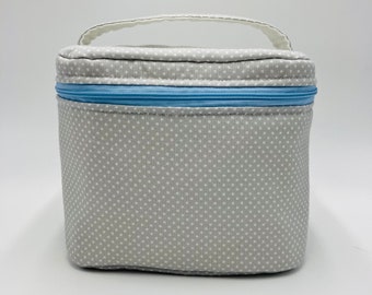 Vanity gray toiletry bag with small white polka dots