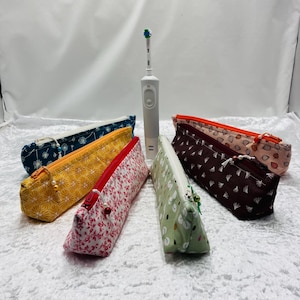 étui à brosse à dents électrique et son chargeur. Original et pratique