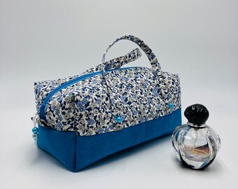 Blue toiletry bag with small flowers