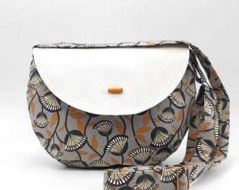 ROUND CROSSBODY BAG with brown floral flap