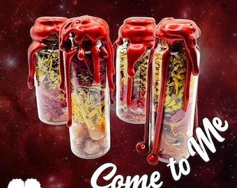 May include: Four clear glass bottles filled with layered dried herbs, flower petals, and small stones. Each bottle is sealed with a cork and topped with bright red wax that drips down the sides. The text Come to Me is written in white script.