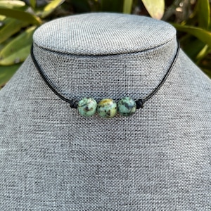 African turquoise knotted leather choker. 3 stone African turquoise choker. African turquoise necklace. Gemstone choker. Gemstone necklace
