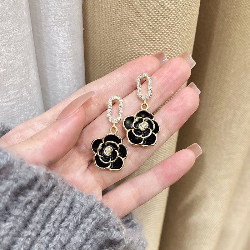 chanel earrings black and gold