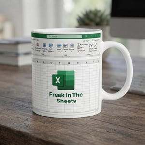 May include: A white ceramic mug featuring a printed graphic of a spreadsheet interface. The design includes the green Microsoft Excel logo and the text "Freak in The Sheets" centered on the front, mimicking a digital workspace layout.