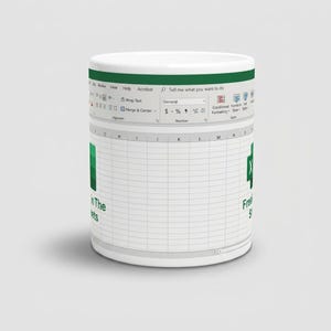 May include: A white ceramic mug featuring a printed graphic of a spreadsheet interface. The design includes a green top ribbon with menu options, a grid of cells, and the text "Freak In The Sheets" alongside the Microsoft Excel logo icon.