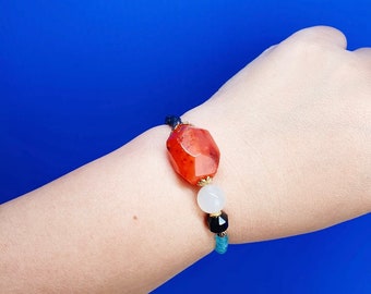 Handcrafted bracelet with Carnelian, Moonstone, Black Stripes Agate, Blue Chalcedony, Red Aventurine and Blue Sapphire