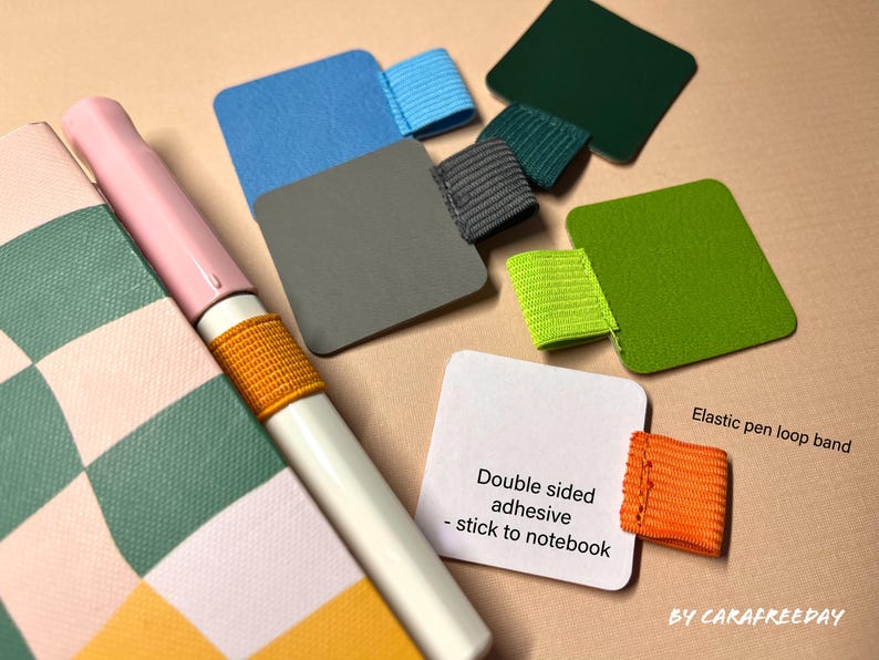 May include: Assortment of colorful felt squares with double-sided adhesive for sticking to notebooks. Each square has an elastic pen loop band attached. The text "Double sided adhesive - stick to notebook" and "Elastic pen loop band" are visible in the image.