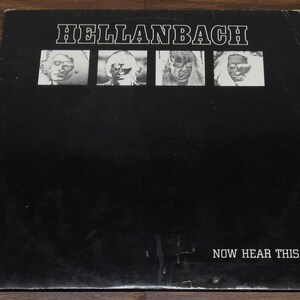 May include: Black and white album cover with the band name "HELLANBACH" in white capital letters. Four black and white photos of band members are arranged in a row above the text "NOW HEAR THIS" in white capital letters.