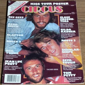 May include: A vintage magazine cover featuring a photo of the Bee Gees band members. The cover is red and white with the title "CIRCUS" in large, bold letters. The magazine is from February 2, 1978, and features articles about various music artists, including Gilda Radner, Neil Young, and Tom Petty.
