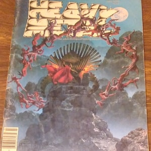 May include: A vintage magazine cover featuring a fantasy illustration of a woman in a red robe sitting on a throne surrounded by winged figures. The magazine is titled "Heavy Metal" and is described as "The adult illustrated fantasy magazine".