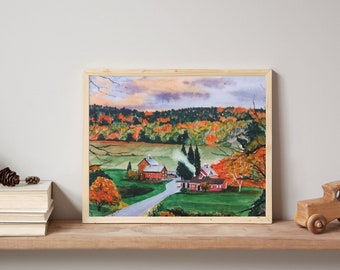 May include: A framed landscape painting depicting a rural scene with red buildings, a winding path, and autumn foliage in shades of orange, yellow, and green under a cloudy sky. The artwork is displayed on a wooden shelf next to books and a wooden toy car.