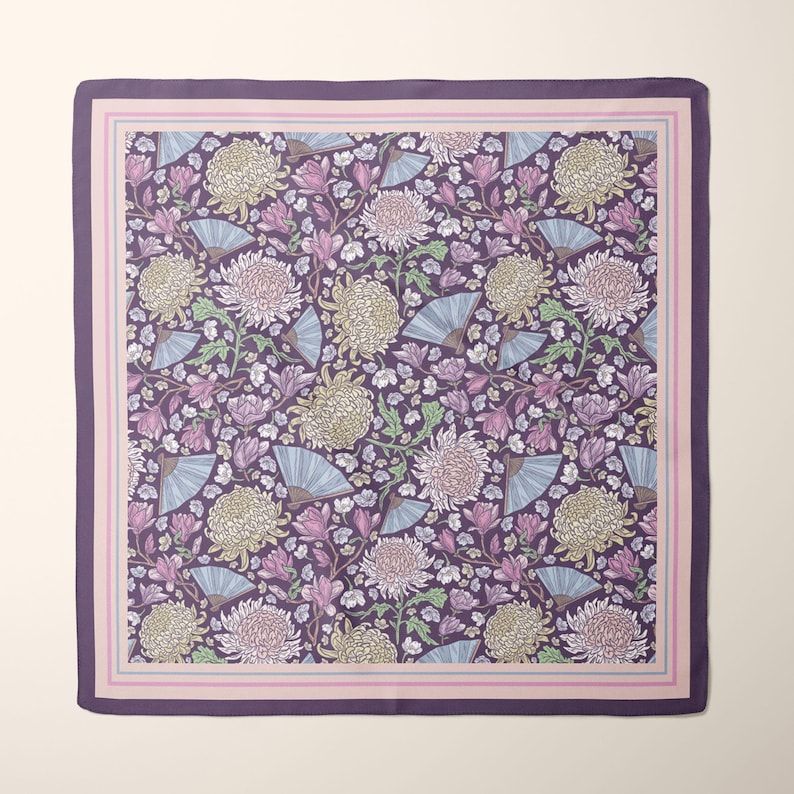 May include: Square scarf with a floral pattern featuring large chrysanthemum blooms, fans, and foliage in shades of purple, pink, and cream. The scarf has a dark purple border and a light pink and purple striped inner border.