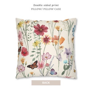 May include: Double-sided pillow case with a floral print featuring pink, red, yellow, and orange flowers with butterflies on a cream background. The back of the pillow case is the same print.