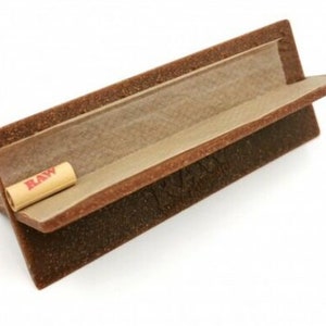 May include: A brown wooden rolling tray with a RAW filter tip inside. The tray has a raised edge and a slanted surface.