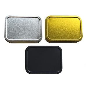 May include: Three small rectangular metal tins, one silver, one gold, and one black.