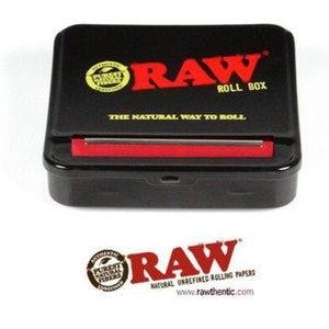 May include: Black rolling paper box with a red lid and the text "RAW ROLL BOX" and "THE NATURAL WAY TO ROLL". The box has a small, round, yellow sticker with the text "AUTHENTIC PUREST NATURAL FIBERS" on it.