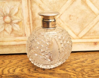 Antique Silver topped Perfume Bottle, Walker and Hall Sheffield 1916, Cut Glass Oval shape.