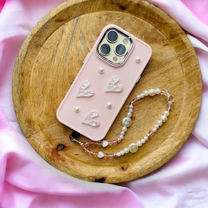Telefoonhoesje - lichtroze kleur - hoesje en telefoonjuweel - hartpatroon - iPhone - telefoonhoesje - telefoonband