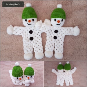 May include: Two crocheted snowman dolls with green hats and black buttons. The snowmen are holding hands and are sitting on a white fluffy surface. Crochet@Teri's is written in the top left corner of the image.