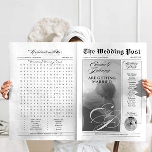 Peut inclure: Un journal d'annonce de mariage noir et blanc avec le titre "The Wedding Post" et les noms "Emma & Johnny" en police décorative. L'annonce indique "Are Getting Married" et comprend une liste de mariage avec des noms et des titres. Le journal présente également une grille de mots croisés sur le thème du mariage.