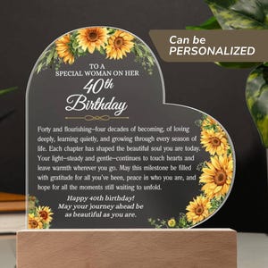 May include: A heart-shaped acrylic plaque with a wooden base, decorated with sunflowers and the text "To a Special Woman on Her 40th Birthday." The plaque includes a personalized message and the words "Can be PERSONALIZED."