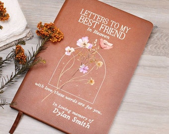 May include: A brown leather journal with the title "Letters to My Best Friend in Heaven" and a floral design. The journal has the words "with love these words are for you... In loving memory of Dylan Smith" printed on the front.