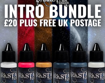 May include: An "Intro Bundle" of Darkstar Molten Metals paints. The image shows six small bottles with black caps and labels. The bottles are labeled "Metal Thinners", "Ruby", "Royal Gold", "Midnight Shroud", "Steel", and "Silver". The background is a gradient of colors.