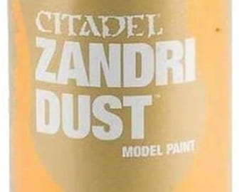 May include: A can of Citadel Zandri Dust model paint. The can is tan with a clear plastic cap. Text on the can includes "Zandri Dust" and "Model Paint". The can contains 10.3 oz / 291g of paint.